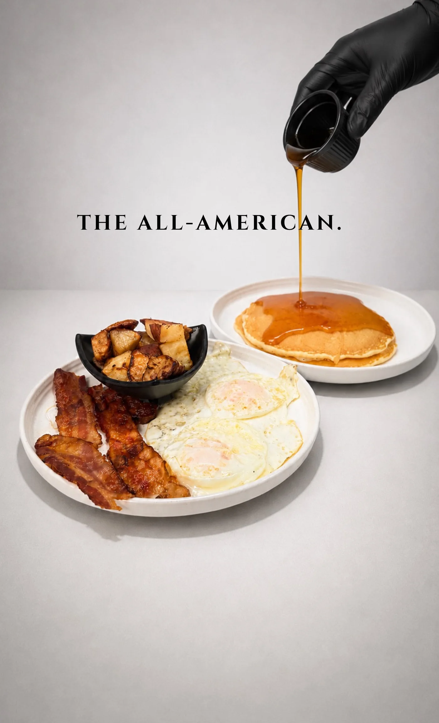 True Baristas All-American breakfast with eggs, bacon, potatoes and a pancake